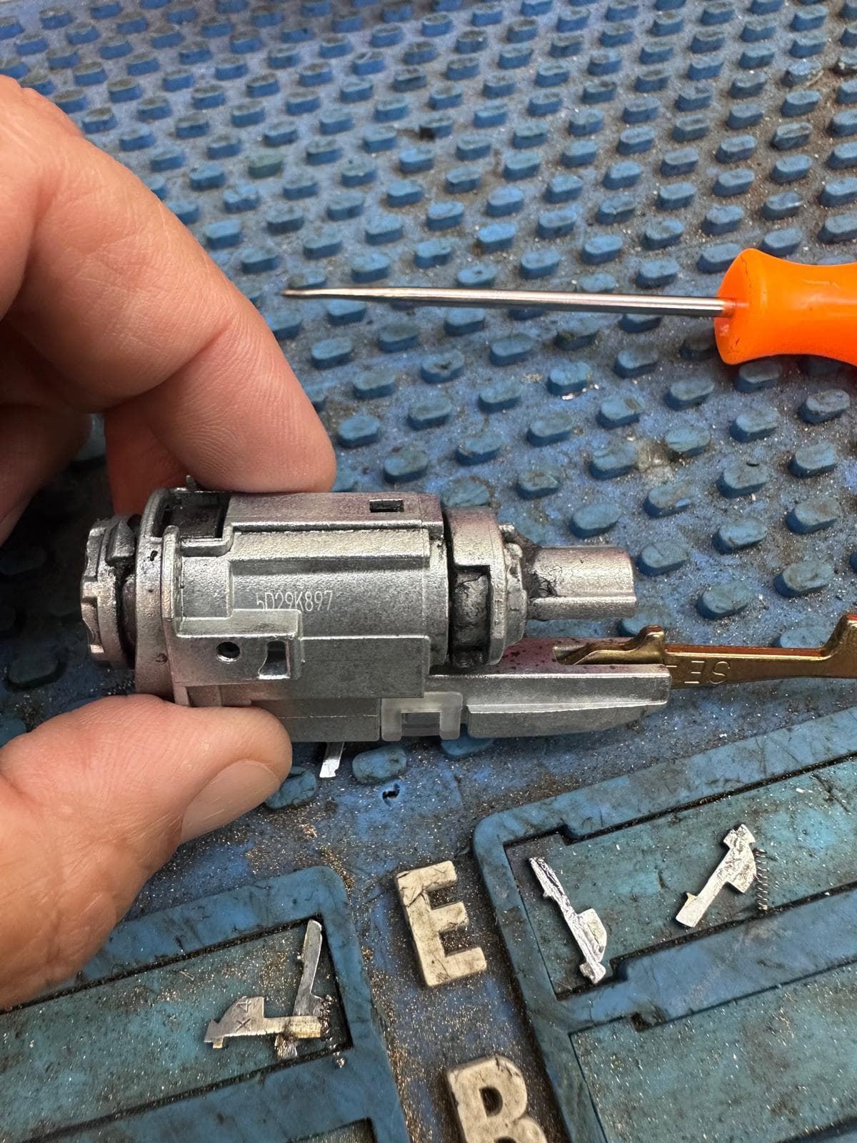 Disassembled Honda ignition cylinder during professional repair by Okey Locksmith in Oklahoma City