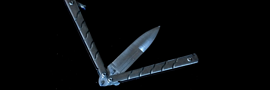 A foldable butterfly knife on a table