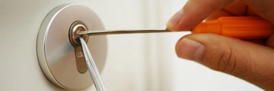 A locksmith picking a lock.