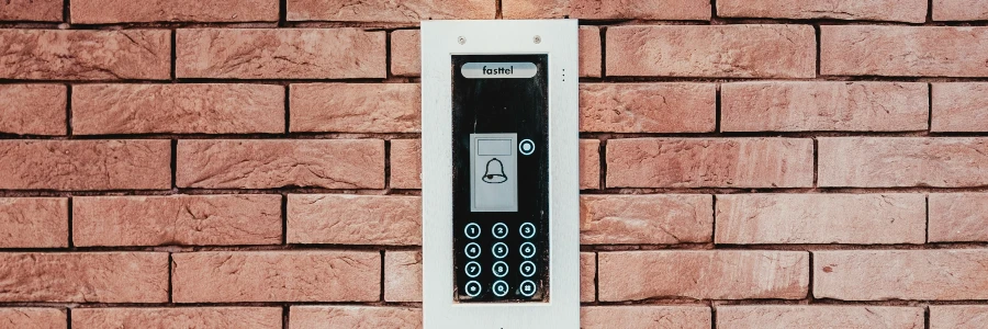 digital door lock on brick wall