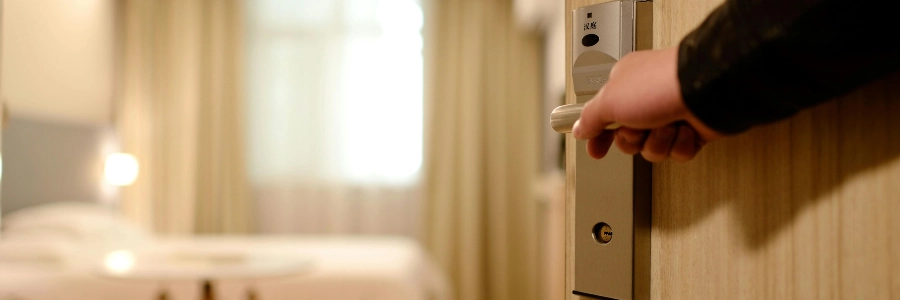 person pushing a door open after keyless entry